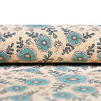 Élégance botanique : motif floral bleu sarcelle et vert sur un support en liège