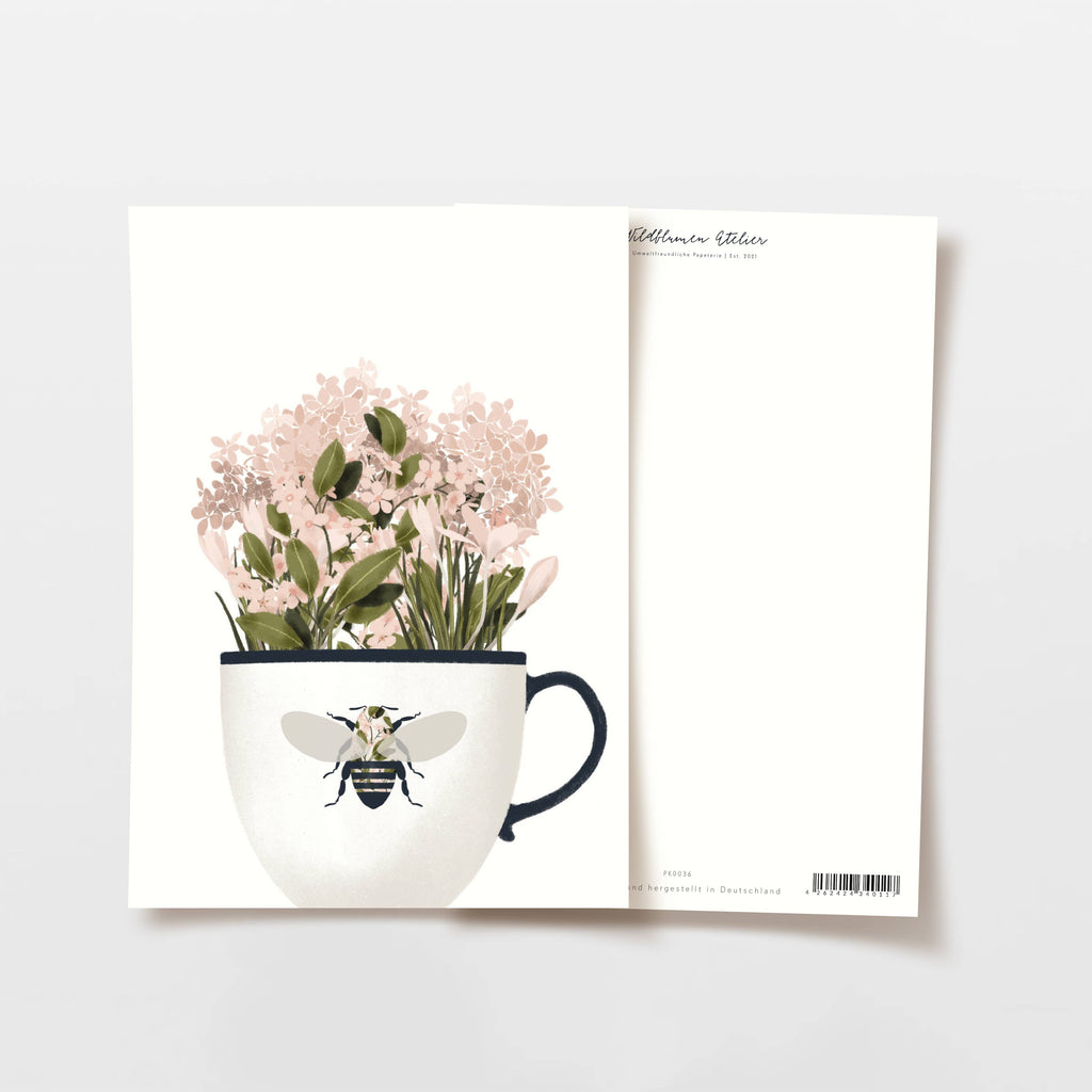 Carte tasse avec fleurs roses et abeille