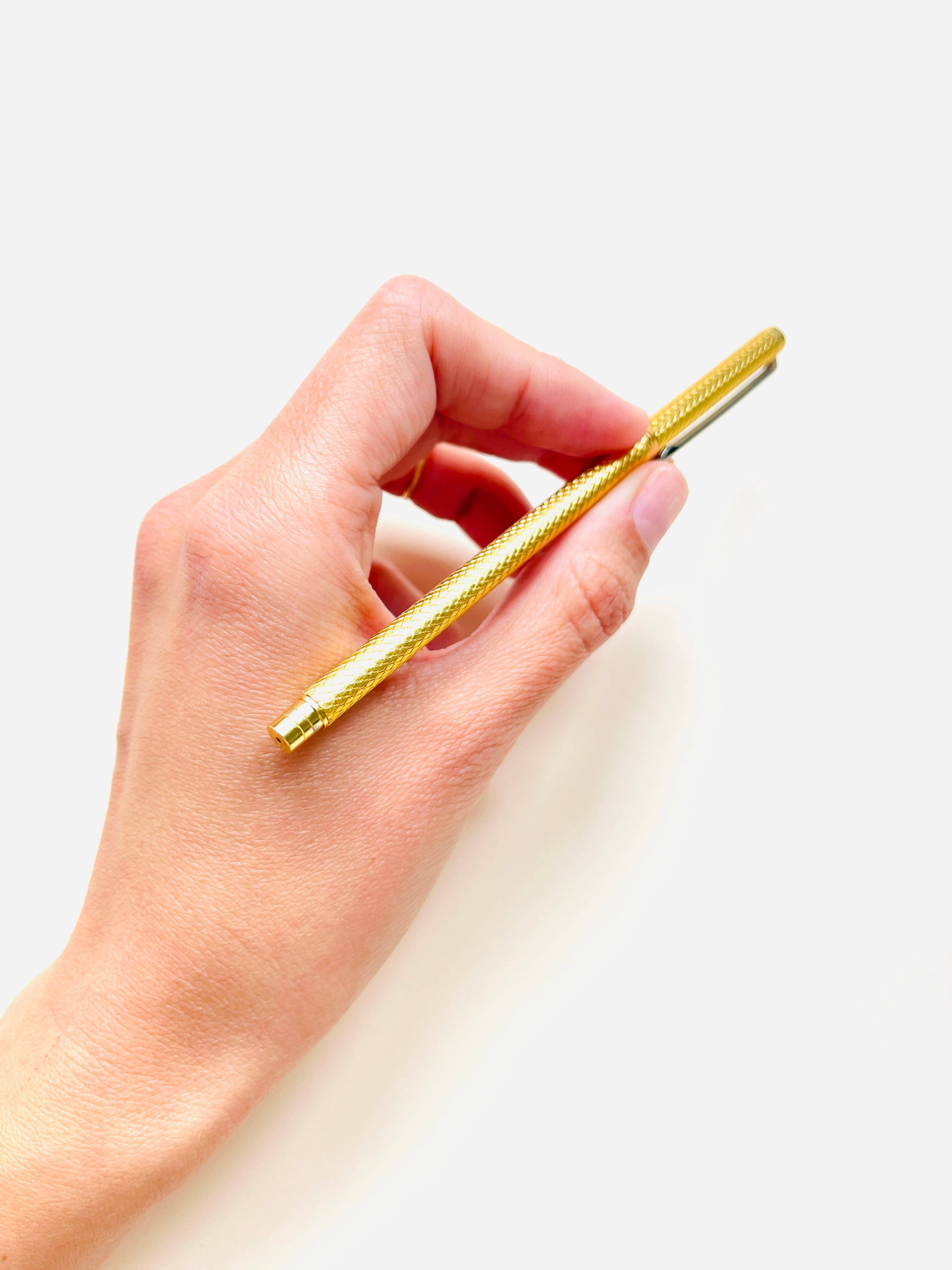 Stylo à bille à écailles doré